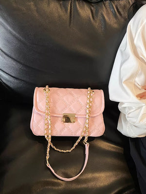 Pink crossbody bag with turn-lock and quilted