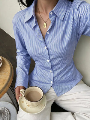 light blue button-down shirt with hip-length and button-front