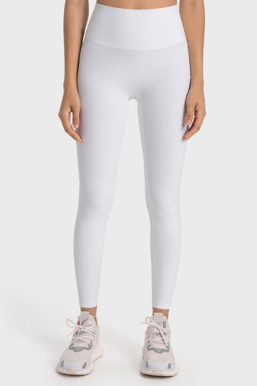 White seamless high-waist performance leggings with a smooth finish.