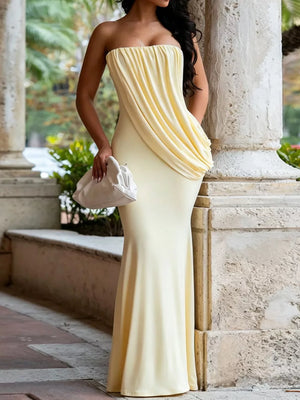 maxi dress in pale yellow featuring ruched and fitted fit