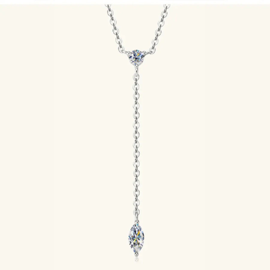Silver lariat necklace with marquise moissanite pendant and round moissanite accent.