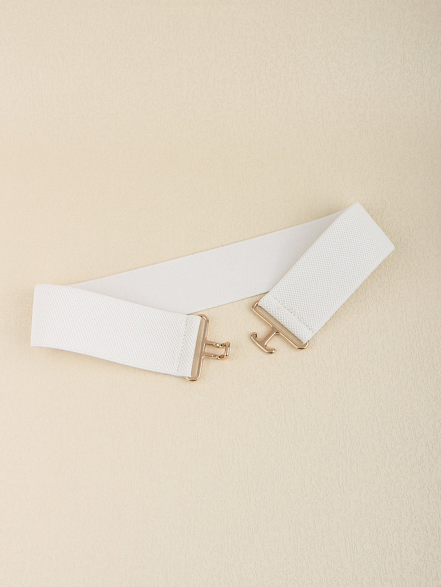 White elastic belt with gold sculpted buckle and hook closure