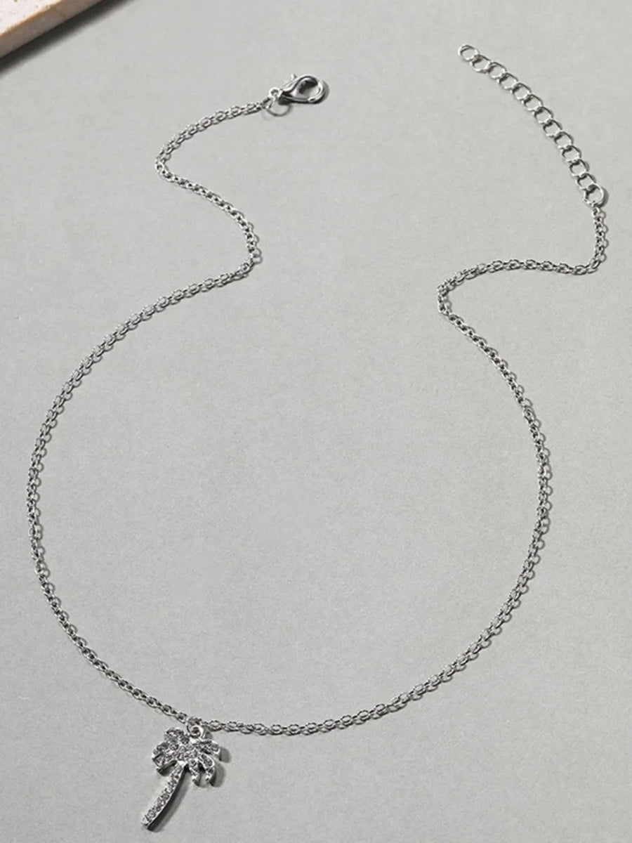 necklace in gold with palm tree motif and adjustable chain