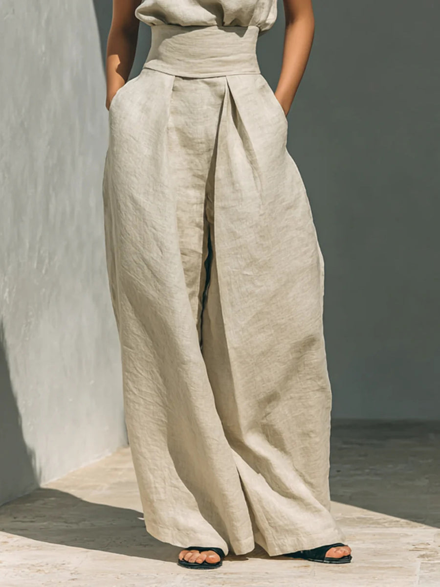 Ivory linen mock-neck top and wide-leg pants set with a high waist and pleats.