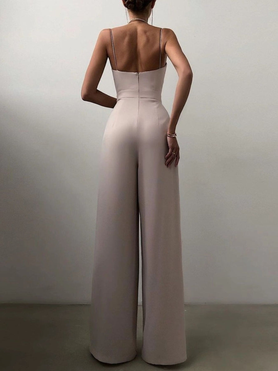 Ruched spaghetti strap wide-leg jumpsuit in Lotus Root, with a fitted bodice and flowing pants.
