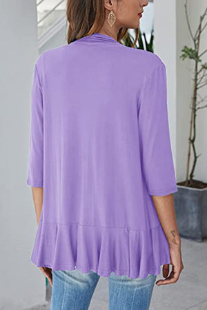 Lavender waterfall cardigan with asymmetric ruffled hem and 3/4 sleeves.