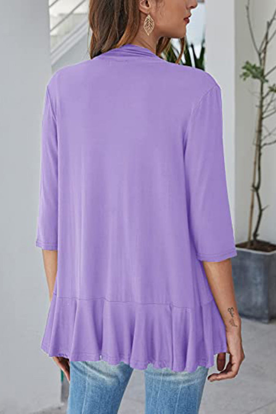 Lavender waterfall cardigan with asymmetric ruffled hem and 3/4 sleeves.