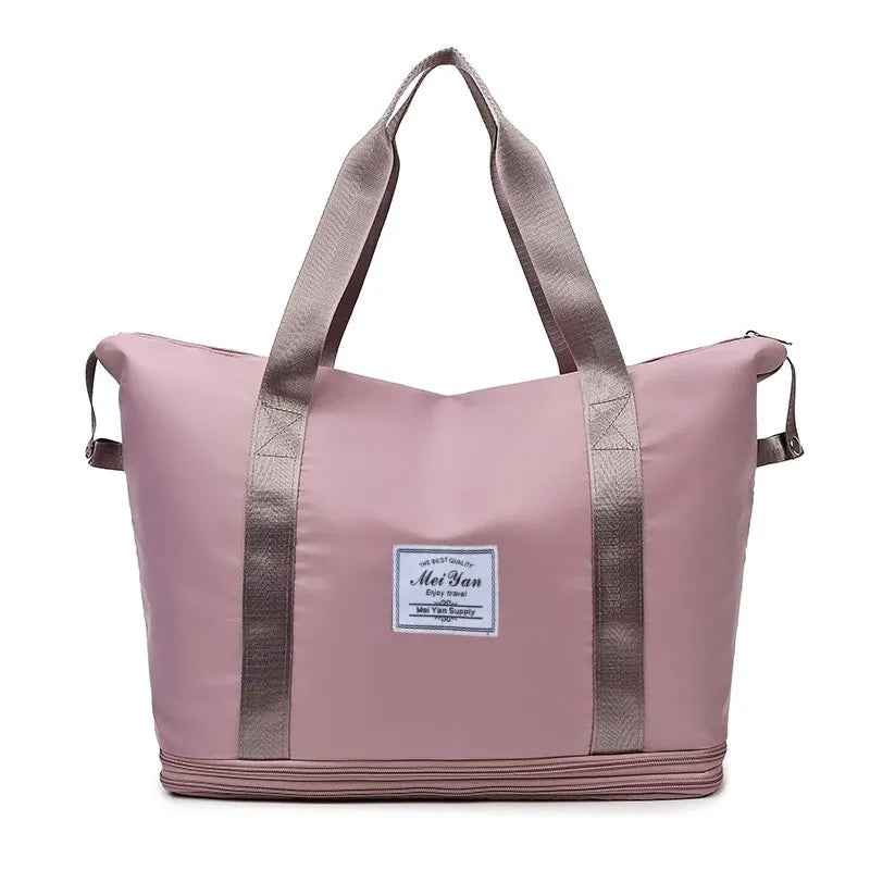 Dusty Pink expandable travel tote with contrast trim and dual handles.