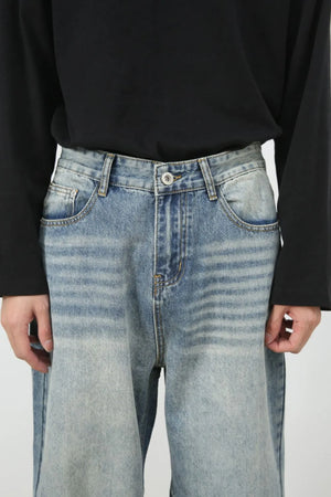 Baggy wash denim jeans in medium blue with a relaxed fit and classic five-pocket styling.