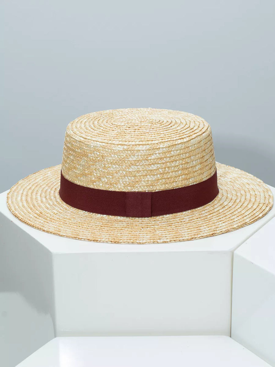 Women's straw boater hat with a wine red ribbon band