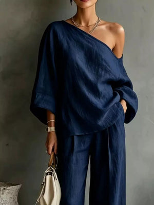 White two-piece set with one-shoulder and elbow sleeve