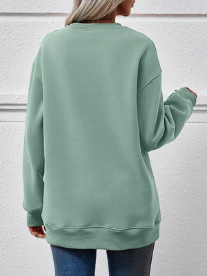 Sage green polyester drop shoulder sweatshirt with crew neck and cuffed sleeves.