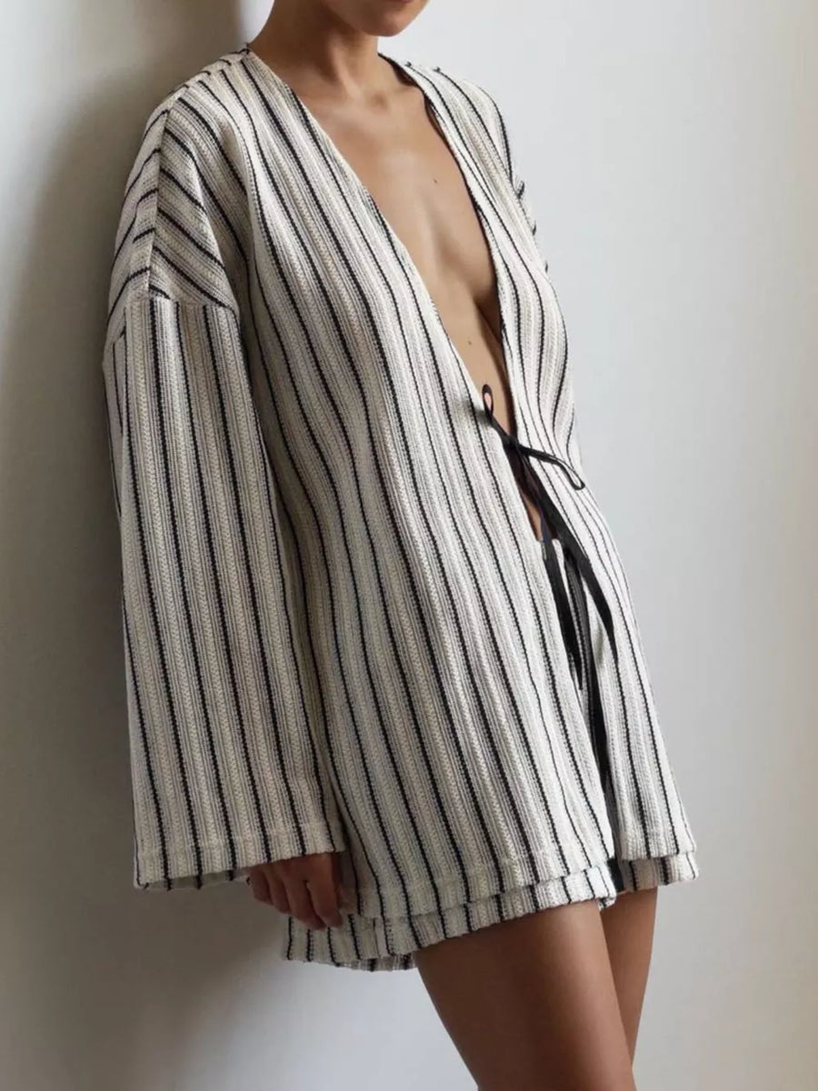 70% polyester, 30% cotton Care instructions: Machine wash cold lounge set in Black with relaxed silhouette
