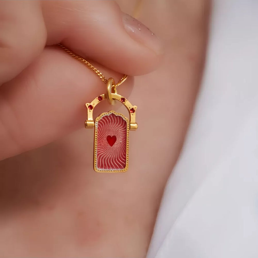 red necklace featuring pendant and graphic