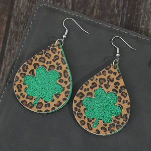 Leopard print teardrop shamrock earrings in green glitter and brown.
