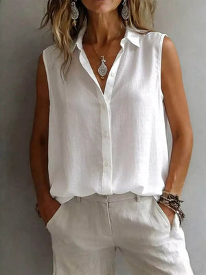 White sleeveless button-up shirt with a collar and button details.