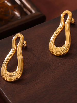 Sculptural gold-tone drop earrings with ribbed texture, 18K gold-plated.