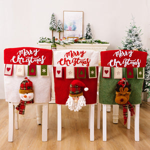 Christmas chair covers in red, white, and dark green with snowman, Santa, and reindeer appliques.