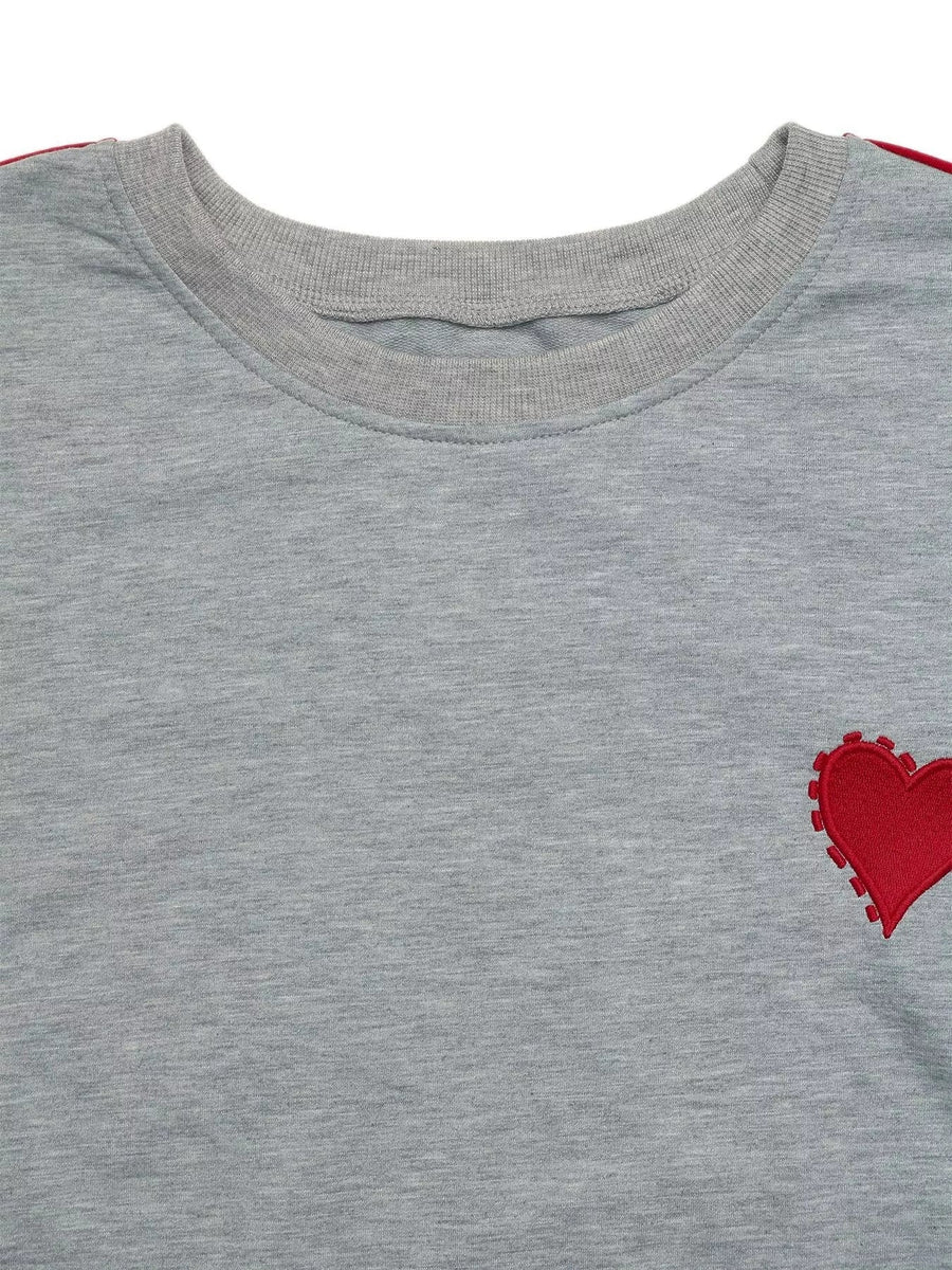 Gray sweatshirt with red heart embroidery detail and red stripe on sleeve.