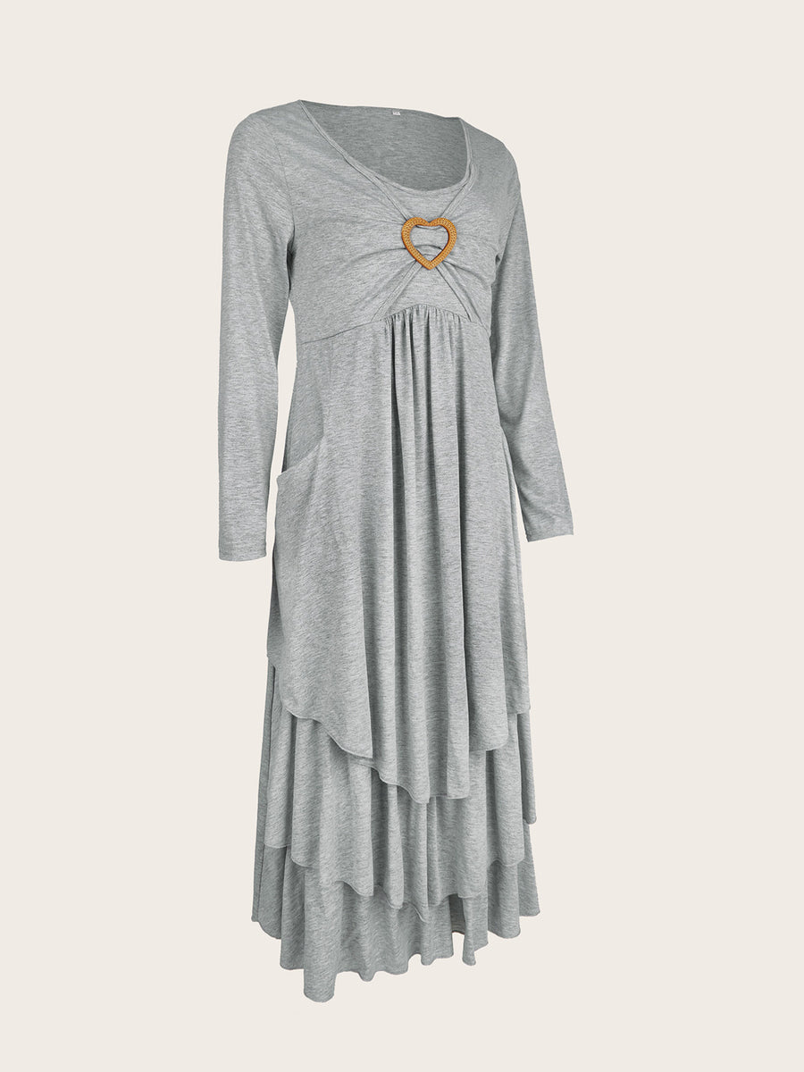 Light gray tiered midi dress with long sleeves, gathered bust, heart detail, and pockets.
