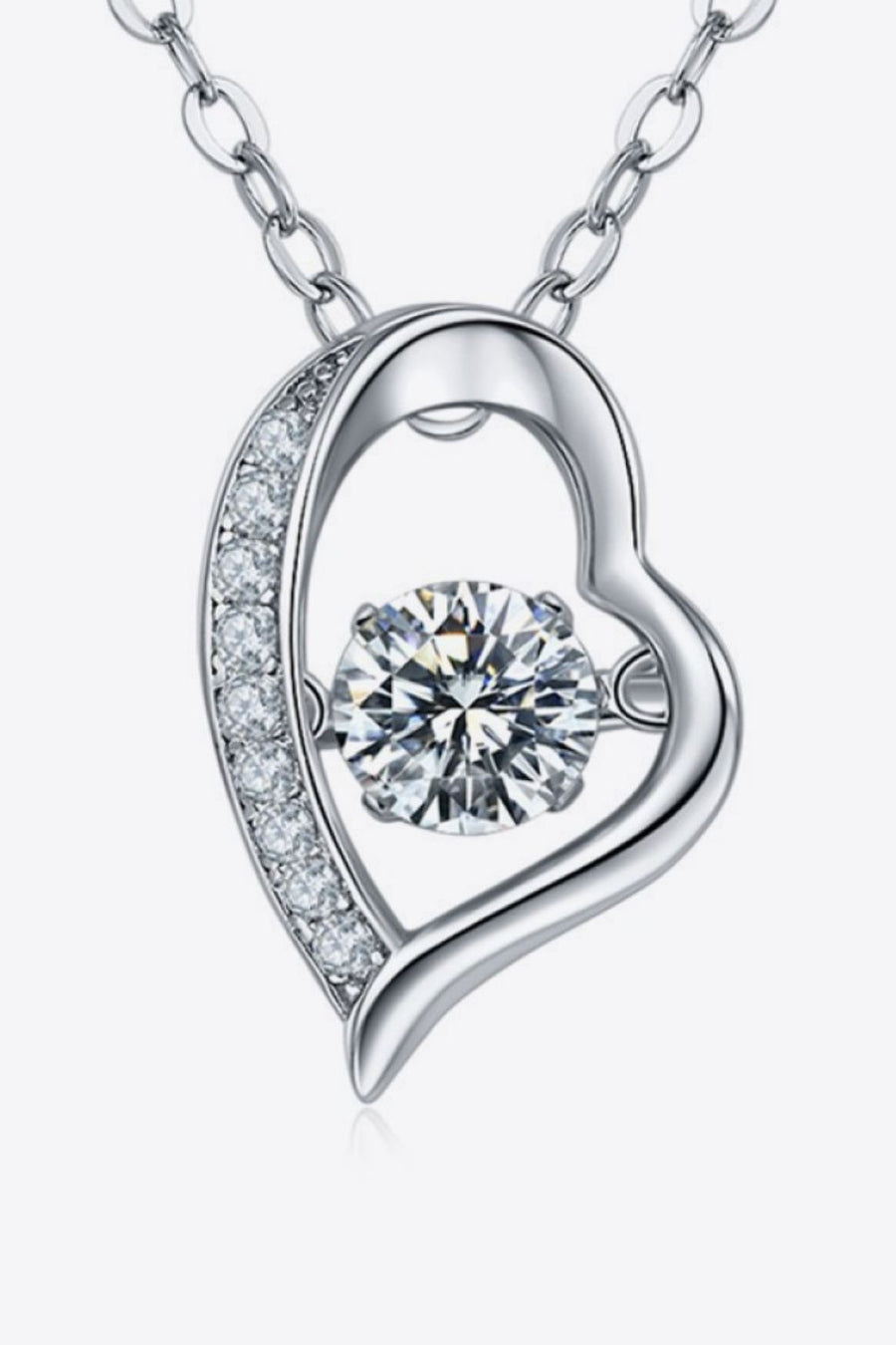 Silver heart pendant necklace with a dancing diamond and pave crystal accents.