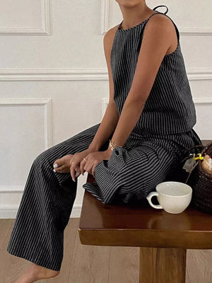 Black striped sleeveless top and wide-leg pants set with tie detail.