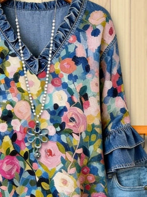 blue blouse featuring ruffled and floral