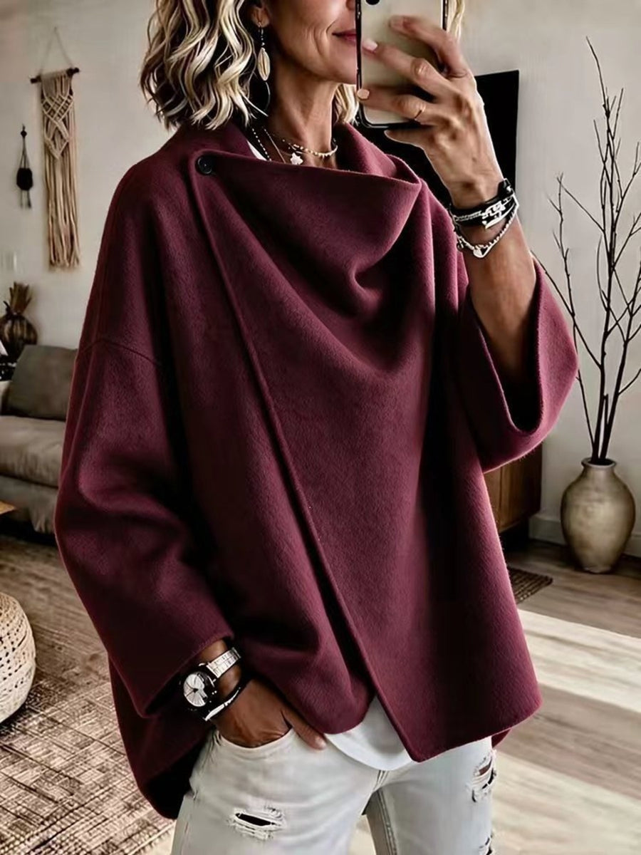 cape in burgundy featuring buttoned and oversized fit