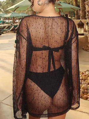 Black sheer knit cover-up with polka dots and tie back detail.