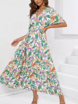 Lemon Leaf Print V-neck Midi Dress in Black Forest with tiered skirt and short sleeves.