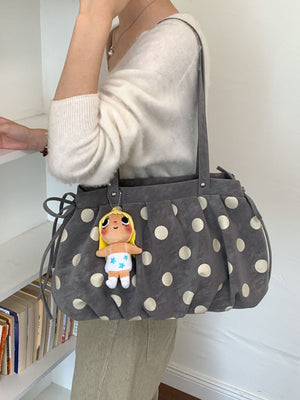 Black shoulder bag with drawstring and polka dot