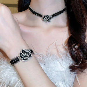 Black rose petal embellished bracelet with crystal accents and beaded details.