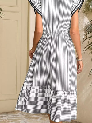Striped midi dress with ruffle sleeves and tiered hem.