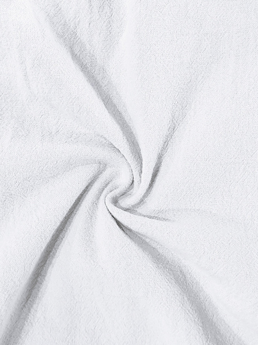 White cargo sweatpants with drawstring detail, showing textured fabric.