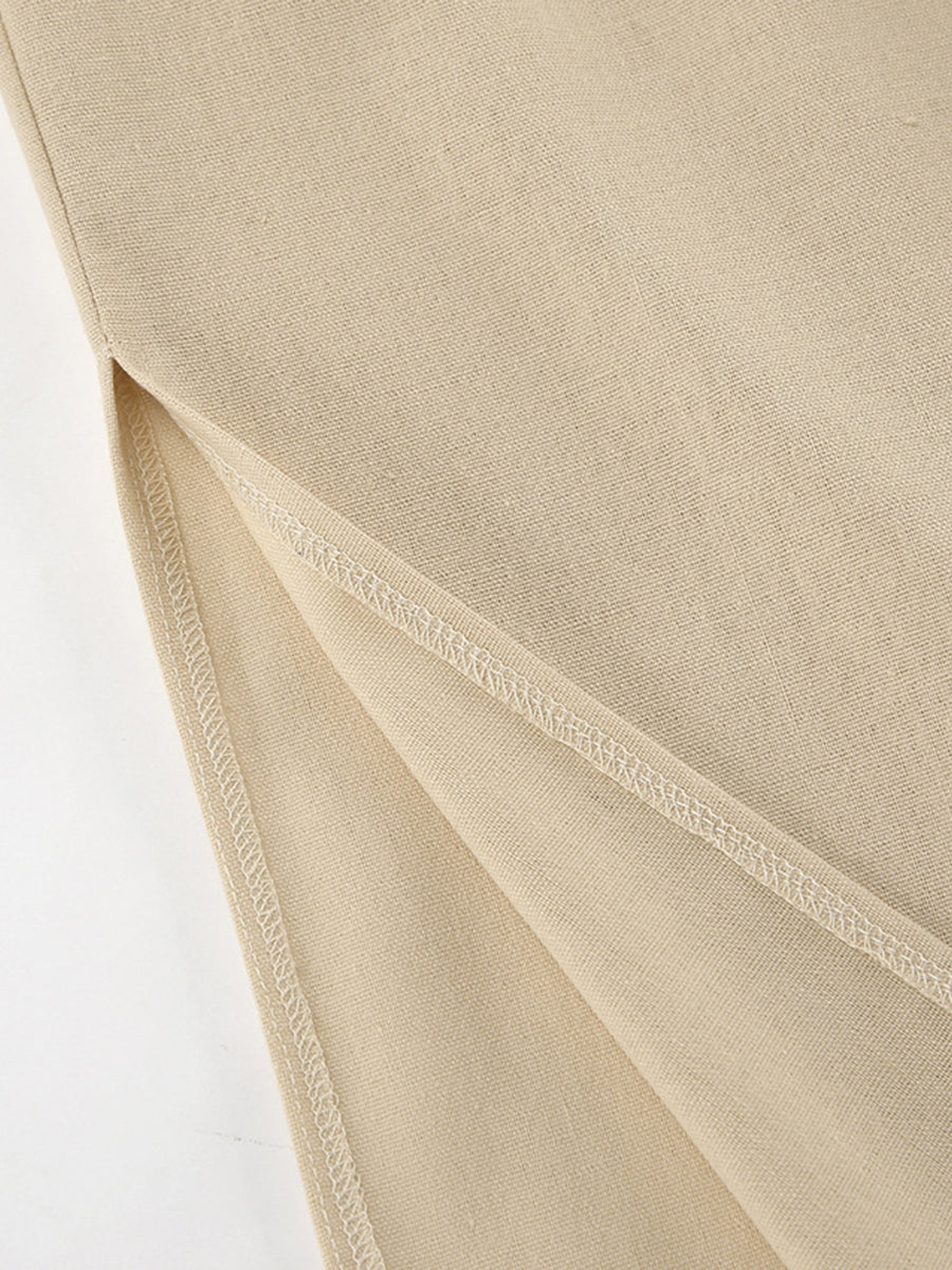 Tan cotton crop top and wide-leg pants set detail showing side slit and stitching.