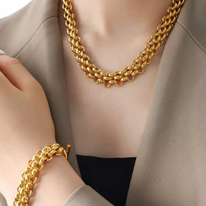jewelry set in gold featuring chain link and relaxed fit