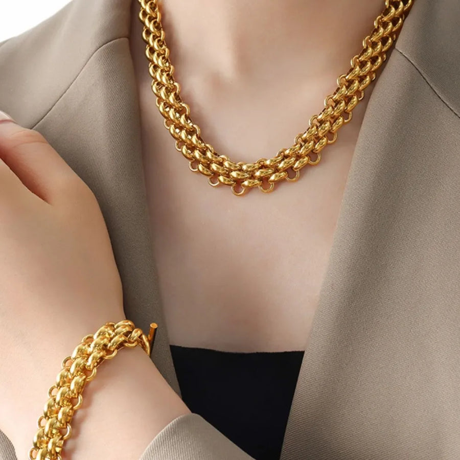 jewelry set in gold featuring chain link and relaxed fit