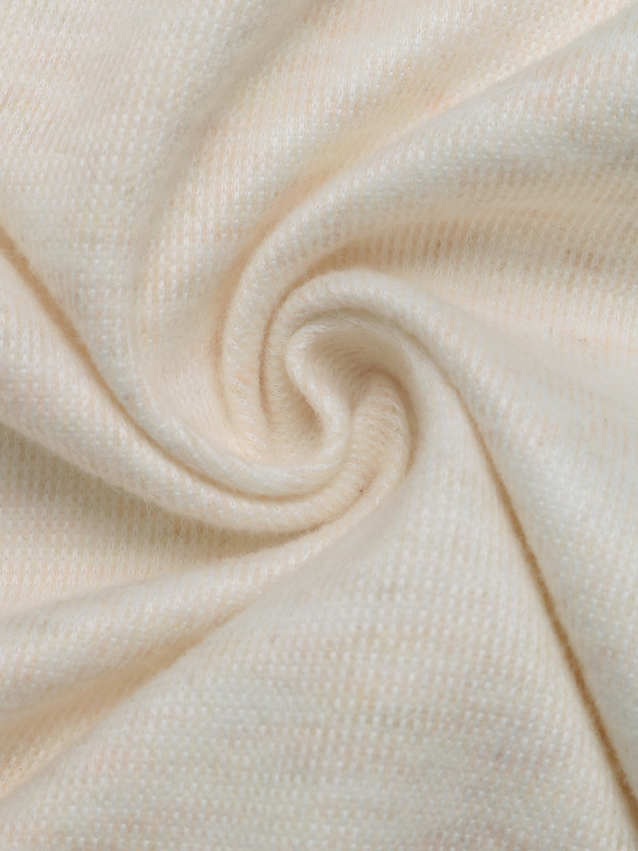 Cream knit fabric with a soft texture
