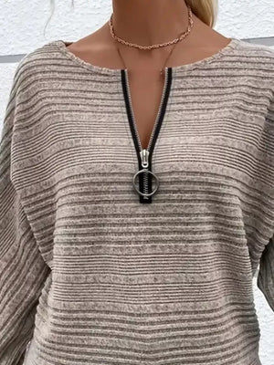 Gray ribbed quarter zip sweatshirt with O-ring pull and dolman sleeves.