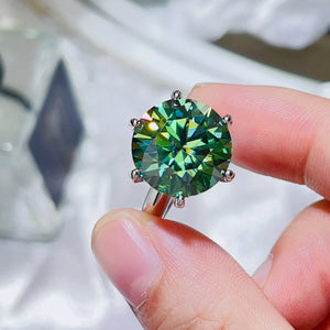 Emerald cut green moissanite solitaire ring in 925 sterling silver.