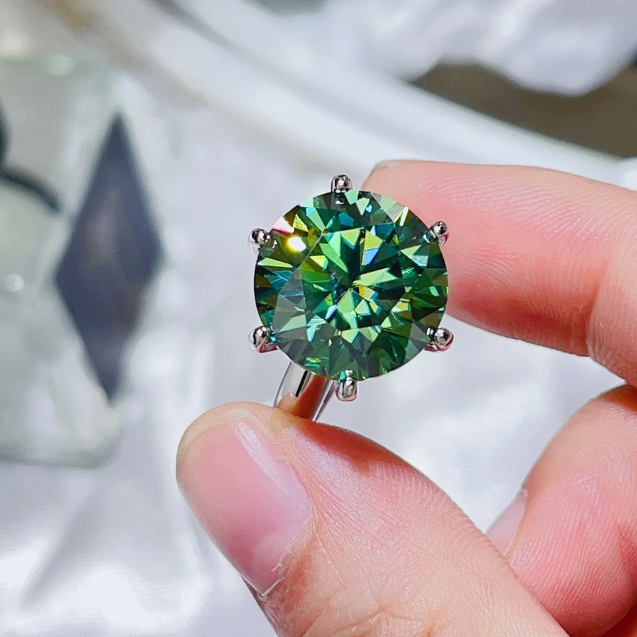 Emerald cut green moissanite solitaire ring in 925 sterling silver.