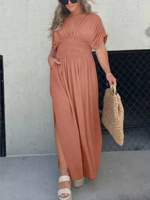 Apricot V-neck dolman sleeve maxi dress with smocked waist and side slits.