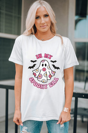 White graphic t-shirt with a floral ghost and bats, reading "In My Spooky Era