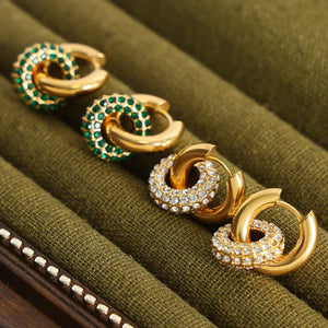 Gold pavé circle interlock hoop earrings with green or clear stones