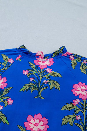 Blue cotton dress with pink floral print and ruffled neckline.