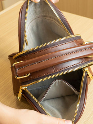 crossbody bag featuring patchwork in brown with PU Leather Imported Size & texture