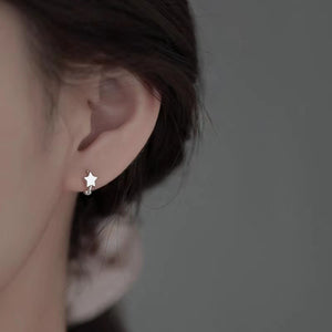 Silver earrings featuring star motif and star