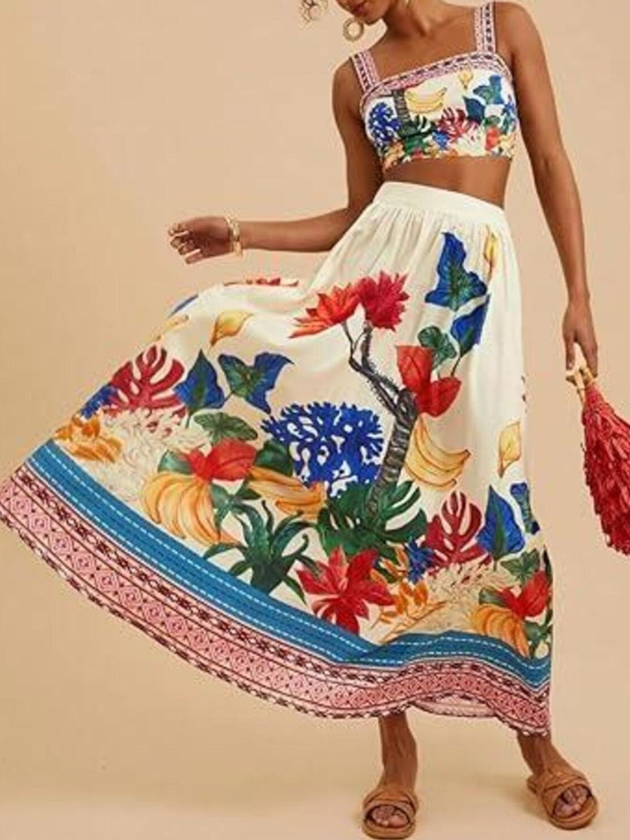 Floral print crop top and maxi skirt set with tropical motifs.