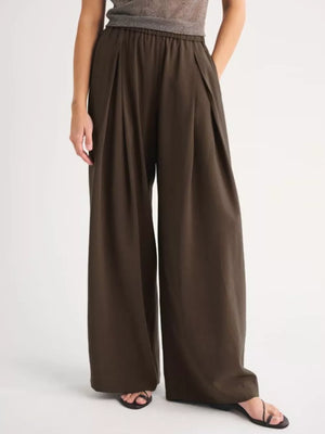 wide-leg pants in dark olive featuring pocketed and wide-leg fit