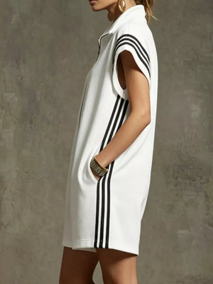 White sporty zip-up romper with black side stripes and pockets.